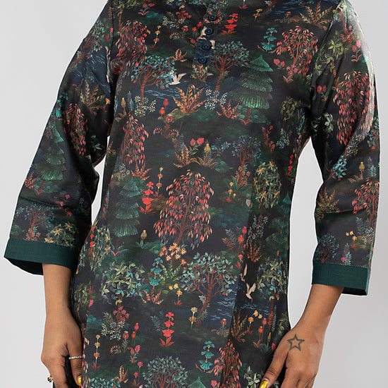 Video of model in the Dori & Dye Midnight Forest Kurta Set, deep teal, turning to show the all-over forest print front and back.