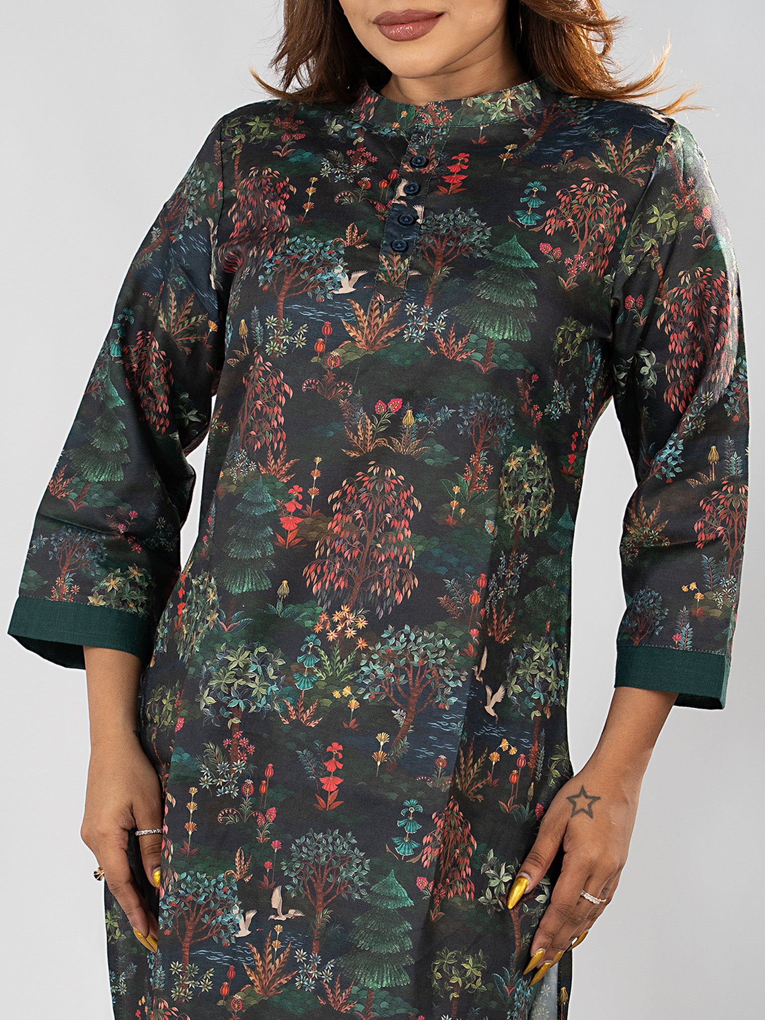 Video of model in the Dori & Dye Midnight Forest Kurta Set, deep teal, turning to show the all-over forest print front and back.